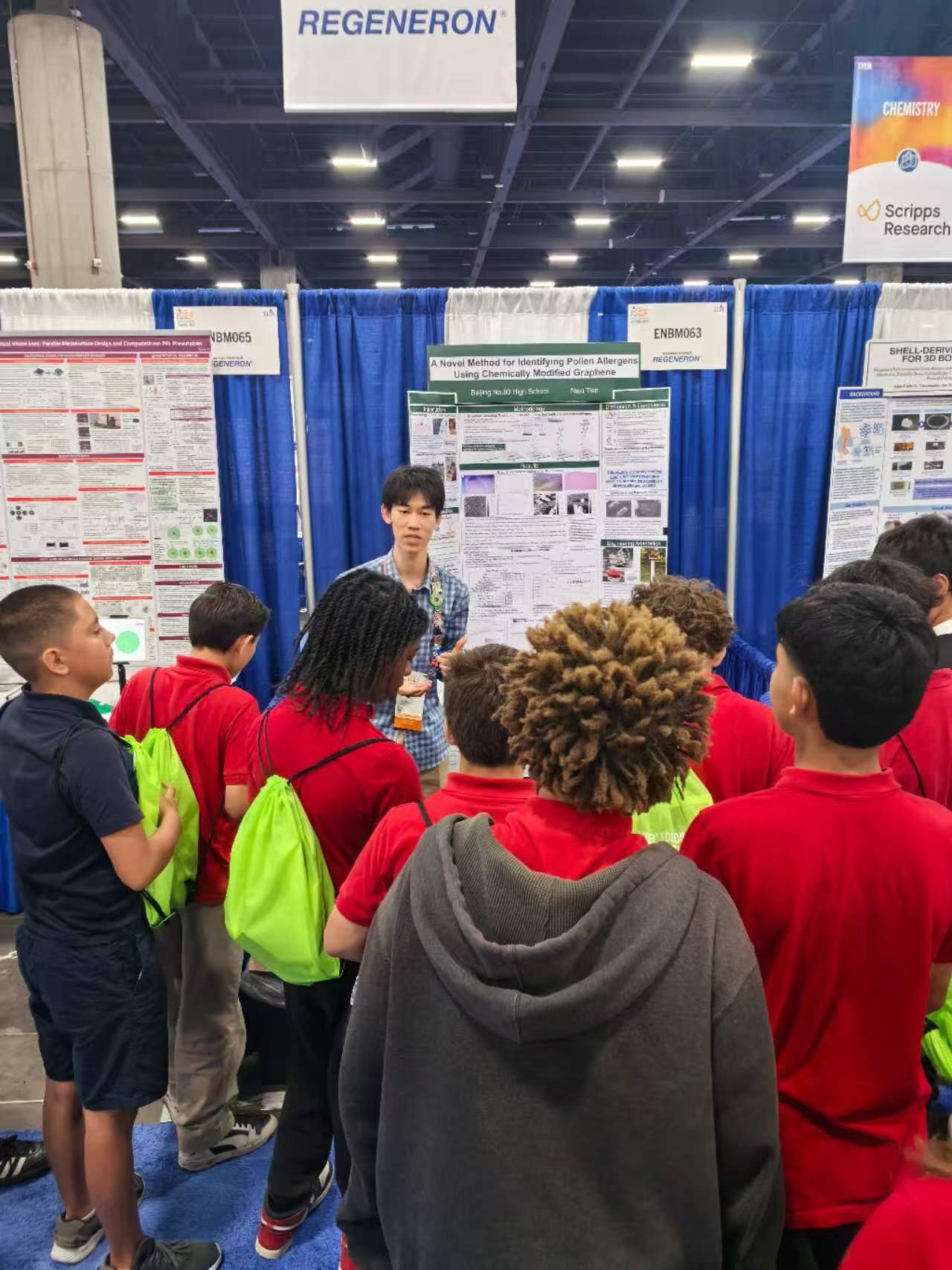 Tenne presenting research to a crowd at ISEF