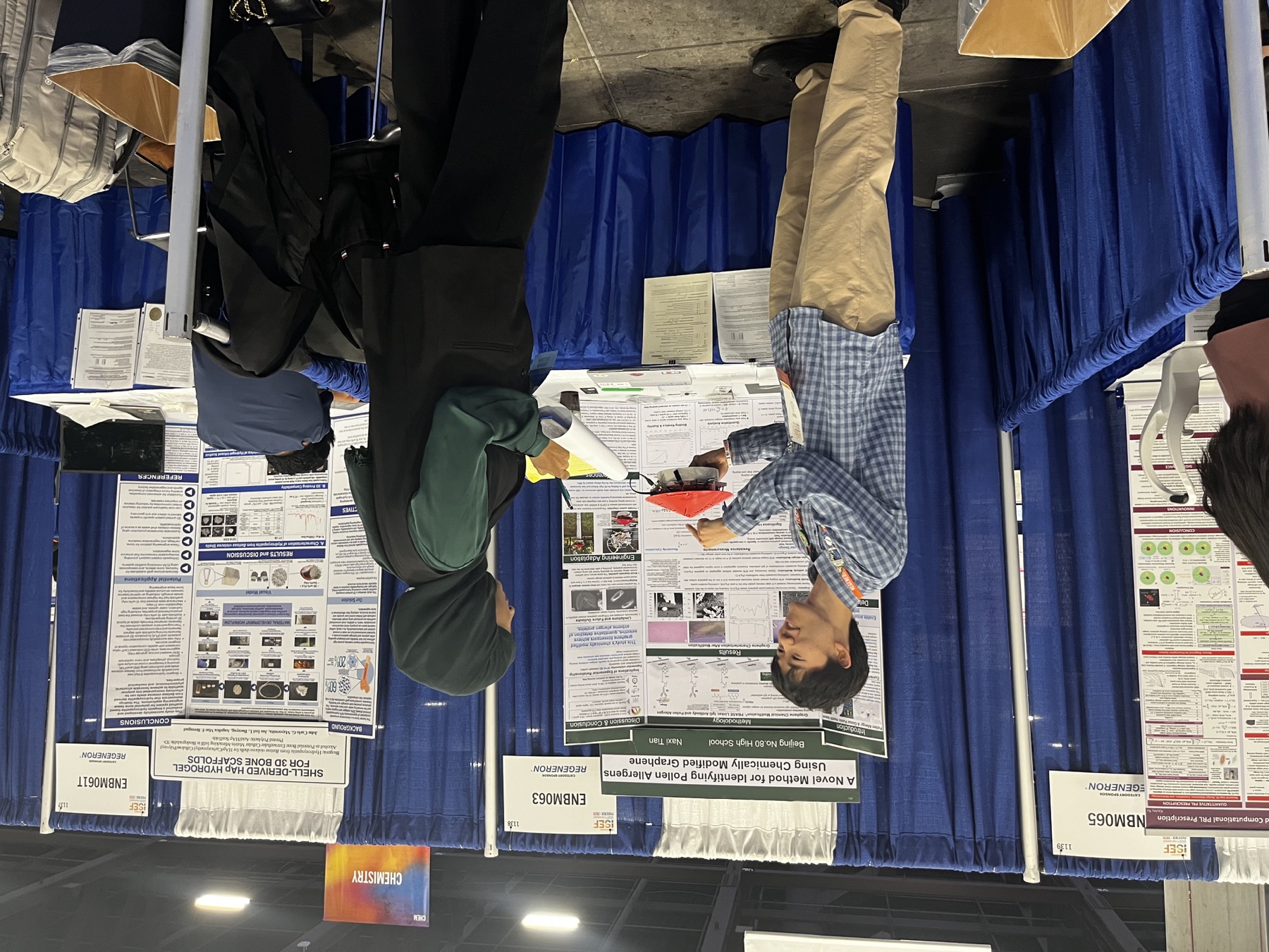 Tenne presenting the graphene pollen sensor to a judge at Regeneron ISEF